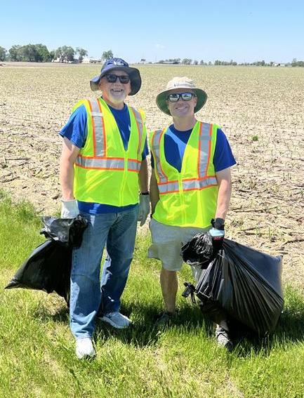 Woody and Chris participating in road clean-up